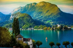 HD wallpaper lake annecy france water mountains houses reflection trees 768x512 1